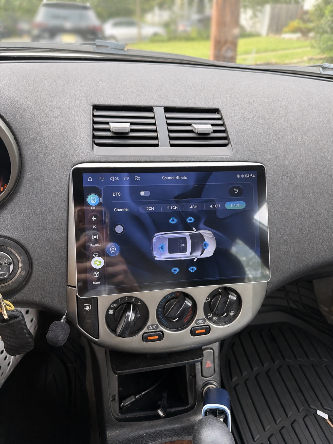 Finished Nissan dashboard with an integrated large touchscreen stereo and repaired dash surface