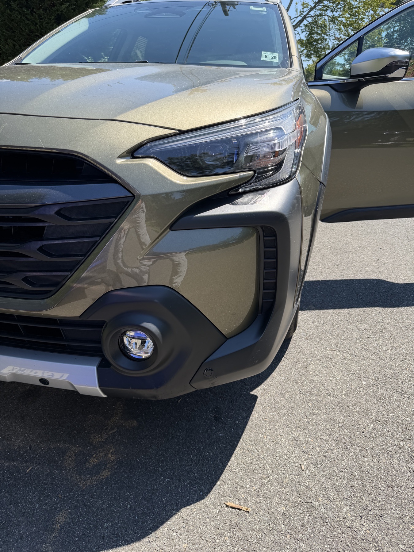 Finished Subaru front bumper with a low-profile parking sensor installed